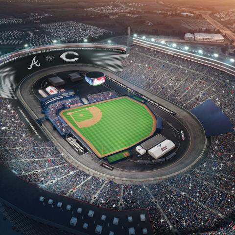 Aerial view of Bristol Motor Speedway at night with stadium lights on with MLB ballpark featured 