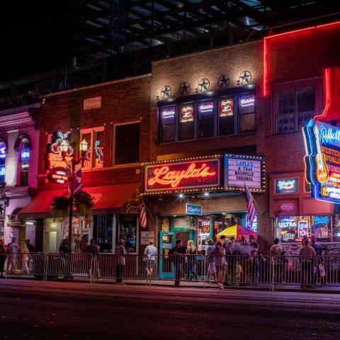 It’s more than just a street, More than a busy four-lane road, More than just a place the shiny new boot tourist goes, It’s where the kid from Minnesota with a big ole dream to chase, Is working on his best new Nashville twang, On the street we call Broadway.