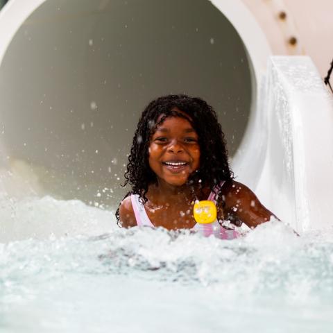 Child plays at Soundwaves while wearing a Laugh Tracker
