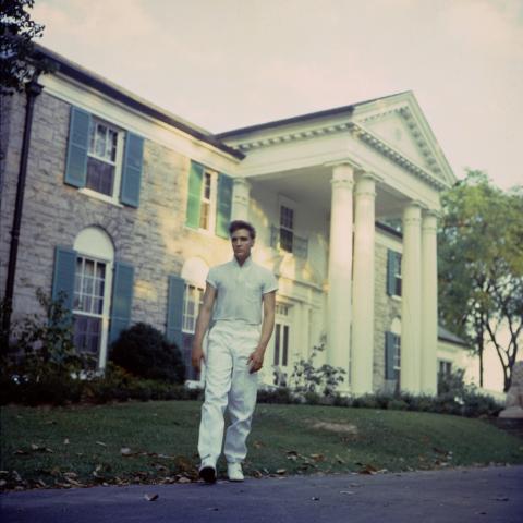 Young Elvis in front of Graceland